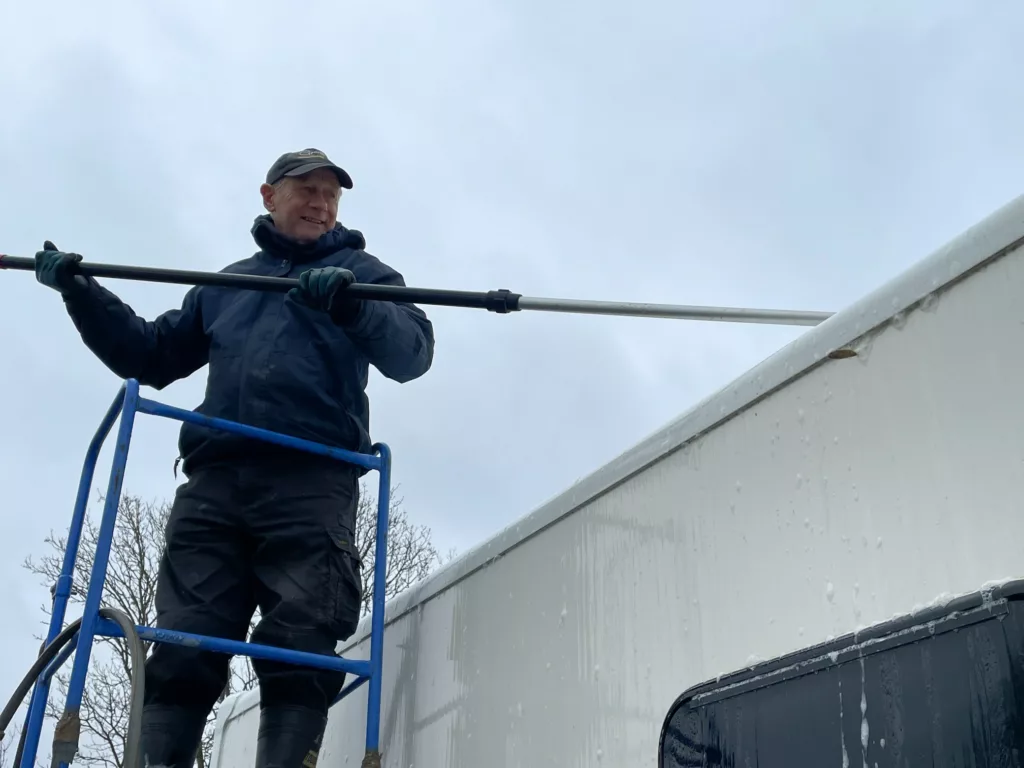 Man Cleaning Caravan Roof
